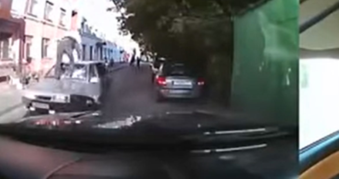 WTF – Man Standing on Moving Car, Kicking Windshield