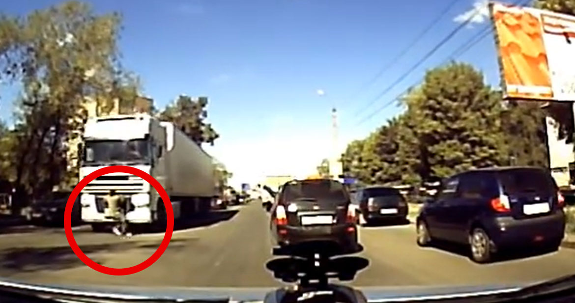 Person Clings to Front Bumper of 18-Wheeler to Avoid Death