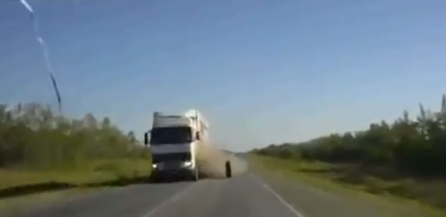 Wheel Falls Off 18-Wheeler and Hits Car