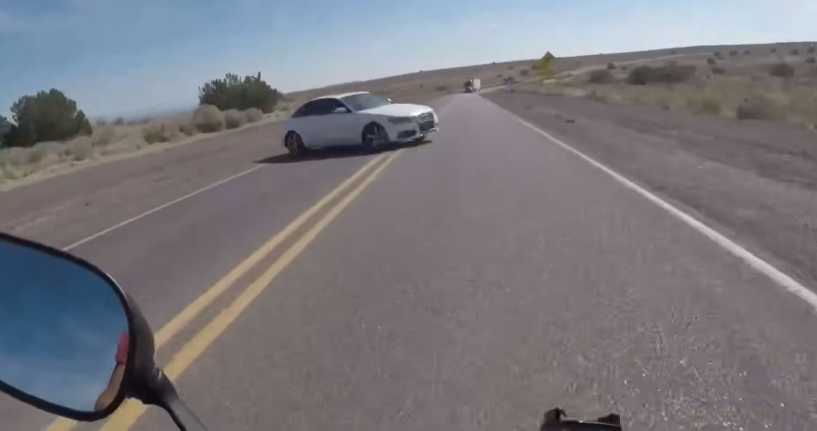 Biker Crashes into Car Making Illegal U-turn